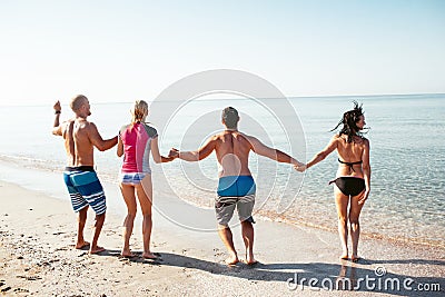 Friends on the beach. Have fun at sunny summer day Stock Photo