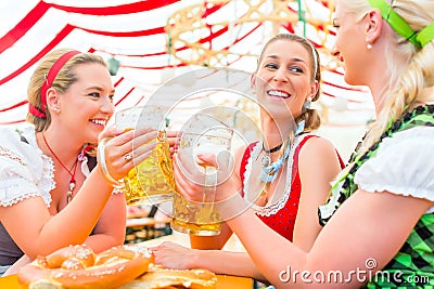 Friends drinking Bavarian beer at Oktoberfest Stock Photo