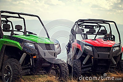Friends driving off-road with quad bike or ATV and UTV vehicles Stock Photo