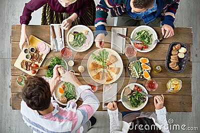 Friends Eating at Dinner Table Stock Photo