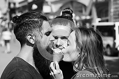 Friends eating tasty ice cream cone Stock Photo