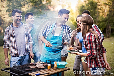 Friends enjoying bbq party Stock Photo