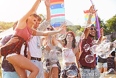 Friends enjoying a performance at a music festival Stock Photo