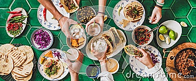 Friends feasting at home taco party with beef tortillas Stock Photo