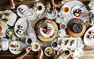 Friends Gathering Together on Tea Party Eating Cakes Enjoyment h Stock Photo