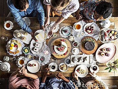 Friends Gathering Together on Tea Party Eating Cakes Enjoyment h Stock Photo