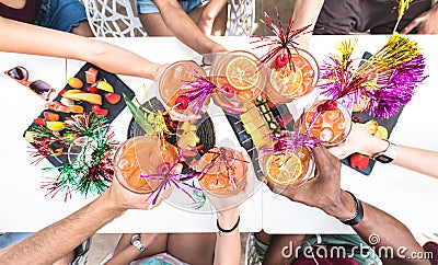 Friends hands toasting summer drinks at cocktail bar on happy hour Stock Photo