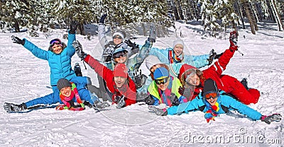 Friends laid on the snow Stock Photo