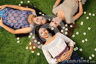 Friends Laying In The Grass Stock Photo