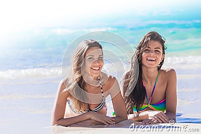 Friends laying on sand Stock Photo