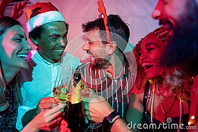 Friends making a toast at New Year party midnight countdown Stock Photo