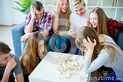 Friends playing jenga Stock Photo