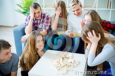 Friends playing jenga Stock Photo