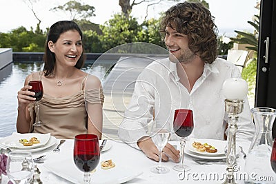 Friends Socialising At Dinner Party Outdoors Stock Photo