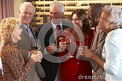 Friends Socializing At A Bar Stock Photo