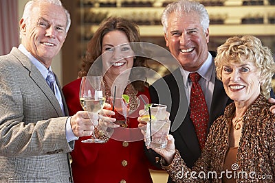 Friends Socializing At A Bar Stock Photo