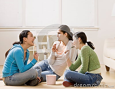 Friends socializing and eating ice cream Stock Photo
