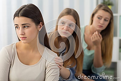 Friends supporting worried girl Stock Photo