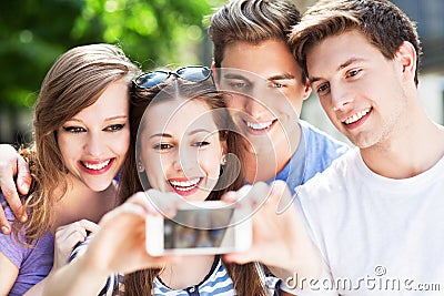 Friends taking photo of themselves Stock Photo