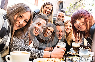 Friends taking selfie at bar restaurant drinking cappuccino and Stock Photo