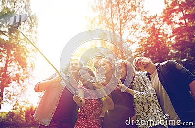 Friends taking selfie at party in summer garden Stock Photo