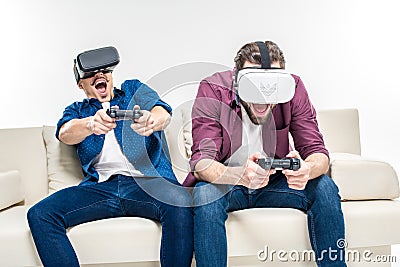 Friends in virtual reality headsets Stock Photo