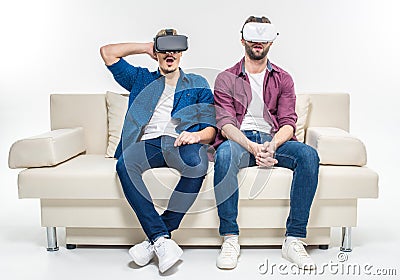 Friends in virtual reality headsets Stock Photo