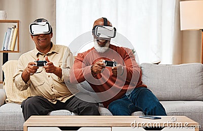 Friends, virtual reality and senior men gaming in home on sofa in living room while laughing. 3d vr, metaverse gamer and Stock Photo