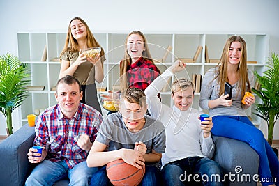 Friends watching basketball Stock Photo