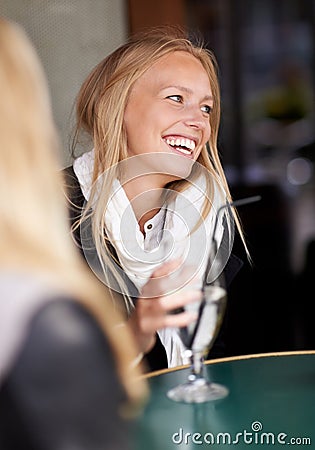 Friends, woman and drink in a cafe, relax and happiness with conversation, weekend break and laughing. People, girl and Stock Photo