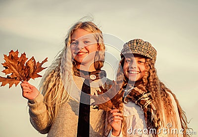 Friendship. autumn trends. kid fashion look. clear sky weather. happy childhood. hairdresser salon concept. small girls Stock Photo