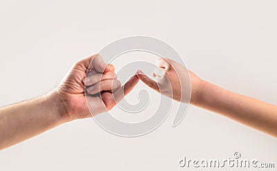 Friendship of generations. Father, daughter hand making promise friendship concept. Child hook little finger together Stock Photo