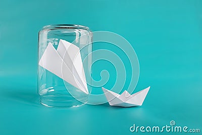 Friendship help concept. Paper planee and ship isolated on blue background. Copy space Stock Photo
