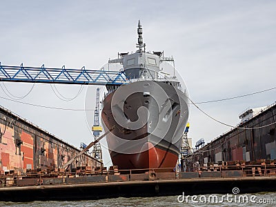 Frigate is being repaired in a dry dock at Blohm und Voss in Hamburg Editorial Stock Photo