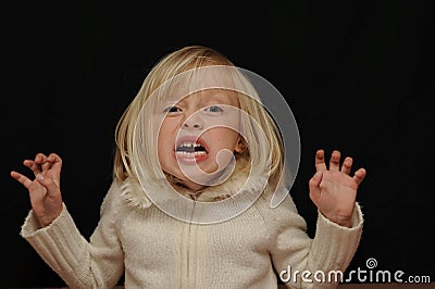 Frightened blond girl Stock Photo