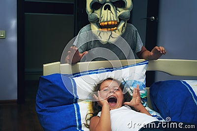 Frightened child at night in bed. Stock Photo