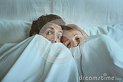 Frightened couple with eyes wide open Stock Photo