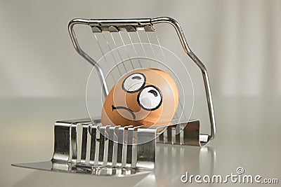 Frightened egg face on the cutter Stock Photo