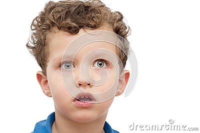 Frightened face of a boy on a white Stock Photo