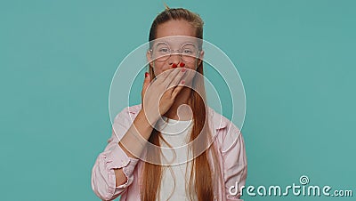 Frightened girl kid closing her mouth with hand refusing to tell terrible secret, unbelievable truth Stock Photo