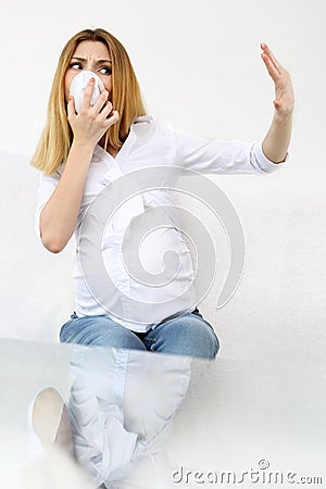 Frightened pregnant woman with protective mask Stock Photo