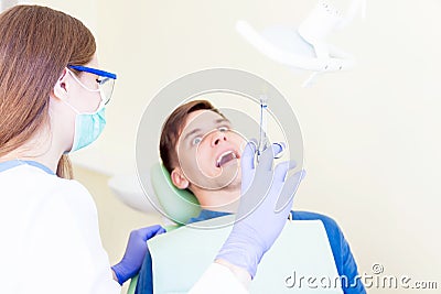 Professional dentist with patient in hospital Stock Photo