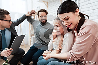 Frightened woman with child is afraid man. Stock Photo