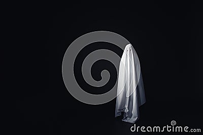 Frightening ghost in white bedsheet Stock Photo