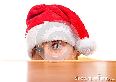 Frightful Young Man in Santa Hat Stock Photo