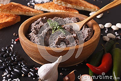 Frijoles refritos with ingredients close-up. Horizontal Stock Photo