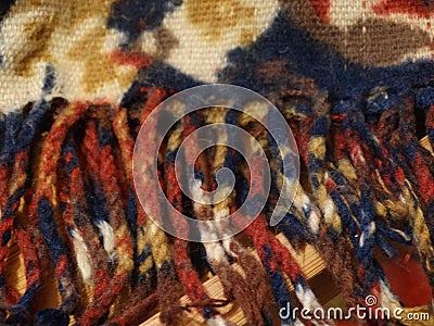 Fringe of a warm winter scarf. Stock Photo