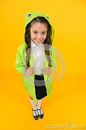 Frog style. Schoolgirl hooded raincoat enjoy fall weather. Rainproof accessories make rainy fall day pleasant Stock Photo