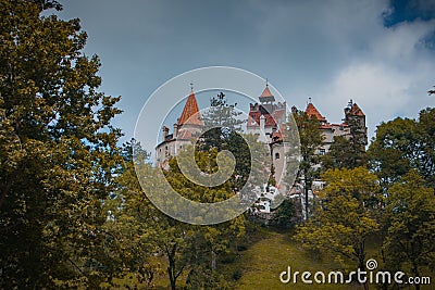 Frog view of Bran castle or famous Dracula's castle, close to Bran, Romania on a cloudy summer day Stock Photo
