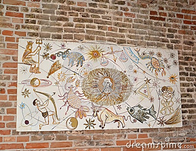 FROMBORK, POLAND. Stand with children `s drawings of Zodiac signs and a portrait of Nikolai Copernicus on a brick Editorial Stock Photo